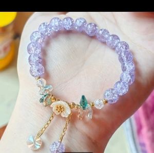 BRAND NEW ** JUST LISTED ** BEAUTIFUL PURPLE BEADED BRACELET WITH HANGING CHARMS